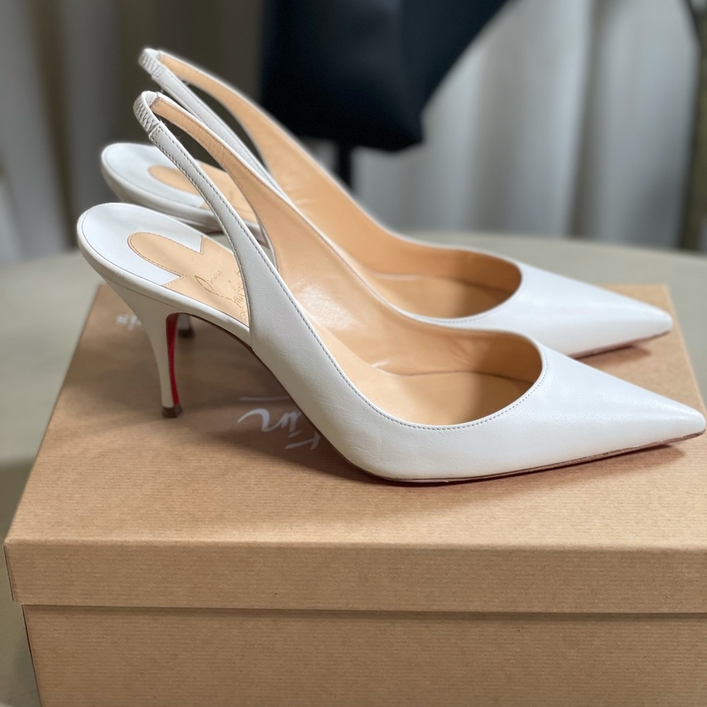 Christian Louboutin white sling backs.